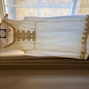 Lily Pulitzer white shift dress with gold detail.